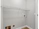 Utility closet featuring gray walls, laminate flooring, and a single wire rack shelf at 2965 Mount Olive Rd., Loris, SC 29569