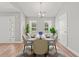 Bright dining room featuring modern table set, neutral walls, and two large windows at 2965 Mount Olive Rd., Loris, SC 29569