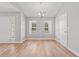 Bright dining room with two large windows, and wood floor at 2965 Mount Olive Rd., Loris, SC 29569