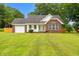 Charming single story brick home with attached garage and manicured front lawn at 2965 Mount Olive Rd., Loris, SC 29569