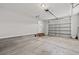 Attached garage with concrete floor, and a roll up garage door with windows at 2965 Mount Olive Rd., Loris, SC 29569