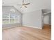 Bright living room features vaulted ceiling and a large window at 2965 Mount Olive Rd., Loris, SC 29569