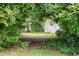 Property featuring some dense backyard greenery and a shed at 300 Crescent Dr., Conway, SC 29526