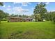 Spacious backyard features a brick home with a patio area ideal for outdoor entertaining at 300 Crescent Dr., Conway, SC 29526