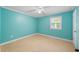 Clean, empty bedroom with carpet, blue walls, white trim, and a window at 300 Crescent Dr., Conway, SC 29526