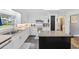 Bright kitchen featuring white cabinets, stainless steel sink, and an island at 300 Crescent Dr., Conway, SC 29526