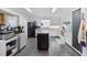 Traditional-style kitchen featuring white cabinets, black appliances and an island at 300 Crescent Dr., Conway, SC 29526