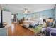 Spacious bedroom with hardwood floors, a ceiling fan, and large windows at 300 Crescent Dr., Conway, SC 29526