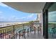 Relaxing balcony view overlooking the ocean and outdoor pool with comfortable seating and plenty of sunshine at 3000 N Ocean Blvd. # 209, Myrtle Beach, SC 29577