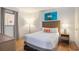 Cozy bedroom with modern decor, wooden floors and ample natural light at 3000 N Ocean Blvd. # 209, Myrtle Beach, SC 29577