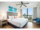Bright bedroom with large window showcasing a beach view and comfortable furnishings at 3000 N Ocean Blvd. # 209, Myrtle Beach, SC 29577