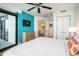 Modern bedroom features a flat-screen TV, balcony access, and neutral color scheme at 3000 N Ocean Blvd. # 209, Myrtle Beach, SC 29577