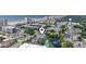 Beautiful aerial shot of condo near the beach, showcasing a parking lot, pool, and picturesque lake view at 305 Hillside Dr. N # 205, North Myrtle Beach, SC 29582