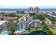 Stunning aerial view of a condo with pool and lake near a beach with high rise condos in the background at 305 Hillside Dr. N # 205, North Myrtle Beach, SC 29582