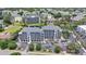 Aerial shot of condo complex with well-maintained landscaping, pool and ample parking at 305 Hillside Dr. N # 205, North Myrtle Beach, SC 29582