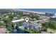 Inviting aerial view of a condo near a serene beach, with pool, a fountain lake and lush greenery at 305 Hillside Dr. N # 205, North Myrtle Beach, SC 29582