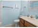 Well-lit bathroom with a neutral color scheme, vanity, and decorative mirror at 305 Hillside Dr. N # 205, North Myrtle Beach, SC 29582