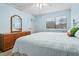 Cozy bedroom showcasing a window and light blue walls, creating a soothing ambiance at 305 Hillside Dr. N # 205, North Myrtle Beach, SC 29582