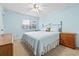 Comfortable bedroom with a large window, soft lighting, and ample closet space at 305 Hillside Dr. N # 205, North Myrtle Beach, SC 29582