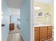 Hallway view leading into a bedroom with light walls and a glimpse of a bathroom at 305 Hillside Dr. N # 205, North Myrtle Beach, SC 29582