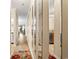 Hallway with mirrors and hardwood floors leading to the kitchen and living area at 305 Hillside Dr. N # 205, North Myrtle Beach, SC 29582