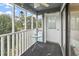Serene screened porch featuring a table and chairs, perfect for enjoying the outdoor scenery at 305 Hillside Dr. N # 205, North Myrtle Beach, SC 29582
