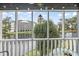 Picturesque view from the screened porch overlooking the lake and nearby buildings at 305 Hillside Dr. N # 205, North Myrtle Beach, SC 29582