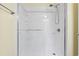 Modern shower stall with white tile and a handheld shower head attachment at 305 Hillside Dr. N # 205, North Myrtle Beach, SC 29582