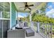 Relaxing porch with outdoor seating, a ceiling fan and views of the surrounding foliage at 305 Splendor Circle, Murrells Inlet, SC 29576