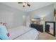 Bedroom featuring a TV, dresser, and light blue walls at 305 Splendor Circle, Murrells Inlet, SC 29576