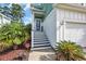 Inviting front porch with stairs, black and white risers, and a 'HOME' sign at 305 Splendor Circle, Murrells Inlet, SC 29576