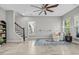 Bright living room with wood flooring, ceiling fan, chair and a stairway at 305 Splendor Circle, Murrells Inlet, SC 29576