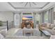Cozy living room with tray ceiling, ceiling fan, gray sofas, and a flat screen television at 305 Splendor Circle, Murrells Inlet, SC 29576