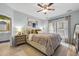 Serene bedroom featuring a plush bed, bedside table, and ample natural light from the window at 305 Splendor Circle, Murrells Inlet, SC 29576