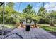 Outdoor patio with a fire pit, chair seating, and string lighting at 305 Splendor Circle, Murrells Inlet, SC 29576