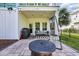 Cozy patio area with a grill, outdoor seating, string lights, and a porch swing at 305 Splendor Circle, Murrells Inlet, SC 29576