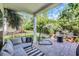 Inviting covered patio with a lounge, egg chair, fire pit, and an outdoor dining set at 305 Splendor Circle, Murrells Inlet, SC 29576