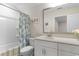 Bathroom featuring a shower/tub combination, a framed mirror, and a white vanity at 3185 Viceroy Loop, Little River, SC 29566