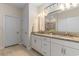 Well-lit bathroom featuring double sinks, granite countertops, and a neutral color scheme at 3185 Viceroy Loop, Little River, SC 29566