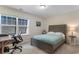 Bedroom showcasing a work station, a window that provides natural light, and a bed with neutral bedding at 3185 Viceroy Loop, Little River, SC 29566