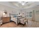 Charming bedroom with a metal frame bed, soft linens, and natural light from the window at 3185 Viceroy Loop, Little River, SC 29566