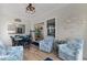 Bright sunroom features dining area with stylish chairs, lots of natural light and coastal decor at 3185 Viceroy Loop, Little River, SC 29566
