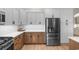 Modern kitchen featuring stainless steel appliances, custom cabinets, and sleek countertops at 3185 Viceroy Loop, Little River, SC 29566