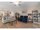 Inviting living room with hardwood floors, comfortable seating, and a view of the staircase at 3185 Viceroy Loop, Little River, SC 29566