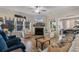 Cozy living room features a fireplace, comfortable seating, and a serene view of the outdoors at 3185 Viceroy Loop, Little River, SC 29566