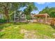 Spacious backyard featuring a fire pit, a large deck, and a screened in back porch at 3597 Sunfish St., Murrells Inlet, SC 29576