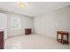 Bright bedroom featuring tile flooring, a window, and two pieces of furniture at 3597 Sunfish St., Murrells Inlet, SC 29576