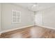 Bedroom showcasing hardwood floors, double windows, and built-in closet at 3597 Sunfish St., Murrells Inlet, SC 29576