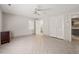 Bright bedroom features tile flooring, ceiling fan, and access to an ensuite bathroom and closet space at 3597 Sunfish St., Murrells Inlet, SC 29576