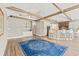 Expansive living area featuring hardwood floors, custom bar and cabinetry and open access to the kitchen at 3597 Sunfish St., Murrells Inlet, SC 29576